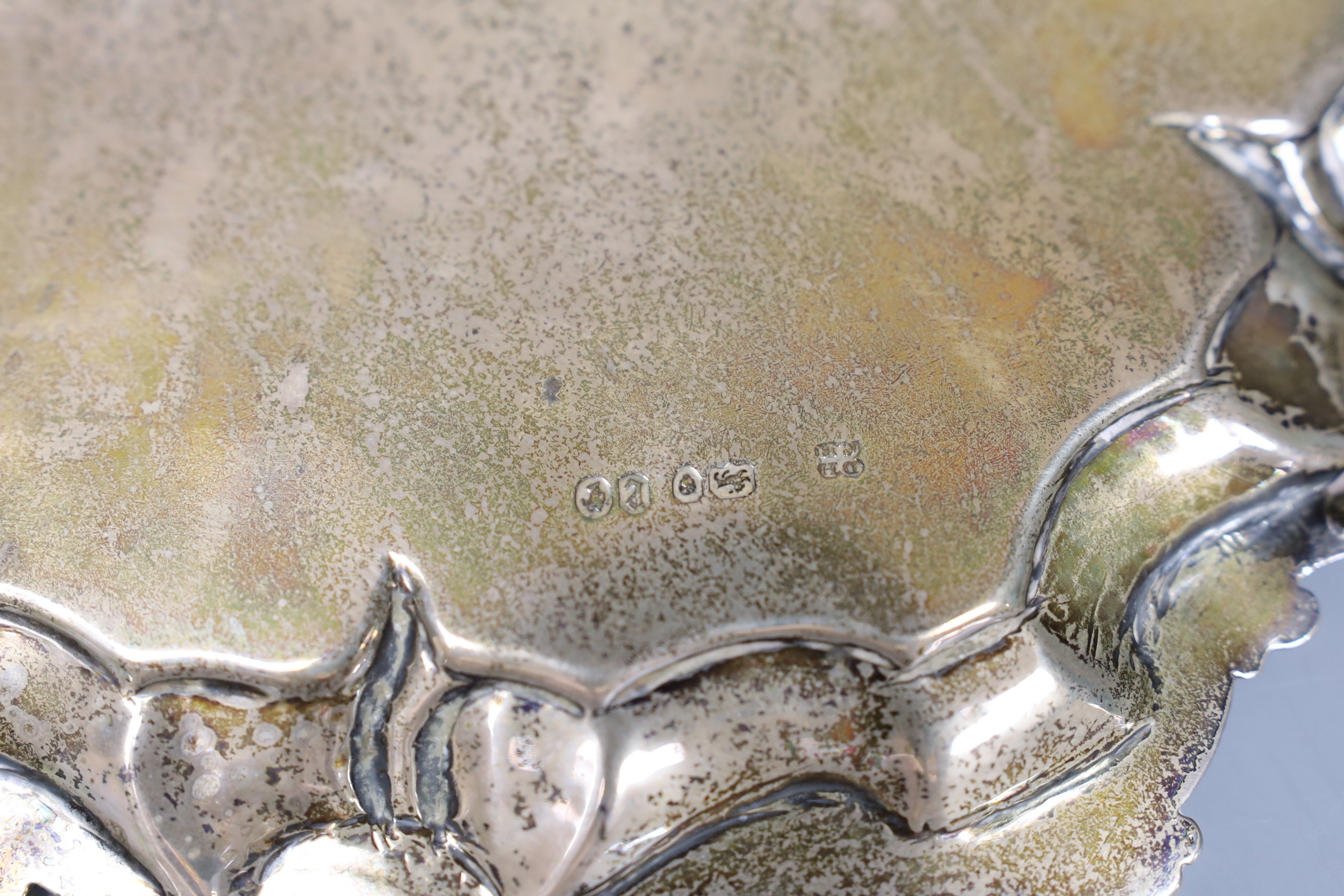 A Victorian silver waiter with scroll and piecrust border, London 1860, 23cm, 13 oz, a Victorian silver cream jug, 4.5oz and a later silver mounted desk calendar